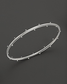 Sterling silver buds blossom on this Elizabeth Showers bangle.