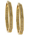 Style, inside and out. These hoop earrings from Vince Camuto step outside the norm. Crafted from gold tone mixed metal, the hoops also feature clear glass accents-inside and out. Approximate drop: 3 inches.