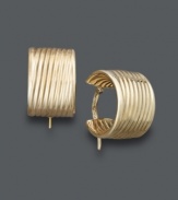 An absolute must-have for every girl's accessory collection. These stunning hoops feature a unique, ribbed design crafted in 14k gold. Approximate diameter: 3/8 inch.