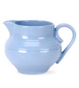 Like a blooming bed of forget-me-nots, this powder-blue porcelain dinnerware has a fresh, natural vibrance. A hand thrown texture gives the rounded creamer the irresistible charm of traditional pottery.