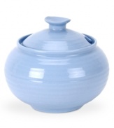 Like a blooming bed of forget-me-nots, this powder-blue porcelain dinnerware has a fresh, natural vibrance. A hand thrown texture gives the round sugar bowl the irresistible charm of traditional pottery.