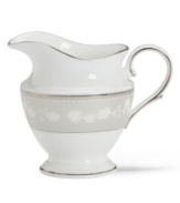 Get set for coffee and dessert. This elegant bone china creamer completes your course with a delicate floral design with textured white beads and elegant platinum trim. From Lenox's dinnerware and dishes collection. Qualifies for Rebate