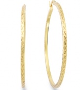 Classic chic. Every girl needs a polished pair of hoops like this traditional Giani Bernini style. Crafted in 24k gold over sterling silver with a unique textured surface. Approximate diameter: 2 inches. Approximate width: 1/10 inch.