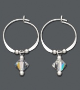 Classic hoops with a crystal touch. These chic earrings by Jody Coyote feature faceted Austrian crystal charm drops accented by silver beads. Crafted in sterling silver. Approximate diameter: 1 inch.