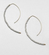 Delicate faceted sterling silver beads line up along the golden arc of an artfully shaped hoop with a modern appeal.14k yellow gold and sterling silverLength, about 2Hoop wireMade in USA