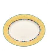 Spice up your main disheds with the Twist Alea oval platter. The bright enamel colorblock design is a perfect contrast to the fine white china. Features a vivid band of color along the rim.