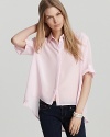 Pretty in pink, this silk Amanda Uprichard shirt takes on the high/low trend and masters it! The airy look is complete with elbow sleeves, keeping things lightweight as the temps rise.