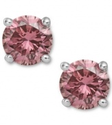 Perfection in pink. These sparkling stud earrings feature round-cut pink diamonds (1 ct. t.w.) in a four-prong setting of 14k white gold. Approximate diameter: 1/5 inch.