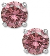 Perfection in pink. These sparkling stud earrings feature round-cut pink diamonds (1-1/2 ct. t.w.) in a four-prong setting of 14k white gold. Approximate diameter: 1/4 inch.