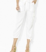 Soft, breathable linen and a cropped-leg silhouette add elegant charm to a traditionally rugged cargo pants for a cool, comfortable fit, from Lauren by Ralph Lauren.