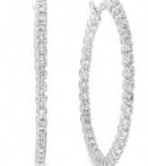 Sparkle that shines from the inside out! These hoop earrings are decorated on both sides with round-cut diamonds (1 ct. t.w.) for ultimate shine. Set in 14k white gold. Approximate diameter: 31 mm.