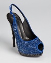 Studded in sparkling Swarovski crystals, these Giuseppe Zanotti slingbacks glitter with every move.