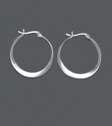 An intriquing twist on a traditional pair of hoops, these sterling silver twist hoop earrings by Unwritten are an instant classic. Approximate diameter: 1 inch.