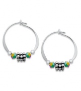 Austrian crystal and daisy-shaped beads adorn these petite hoop earrings by Jody Coyote. Set in sterling silver. Approximate diameter: 5/8 inch.