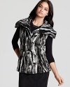 Layered over a tee or ethereal blouse, this T Tahari faux fur vest brings plush softness to the trend-right season.