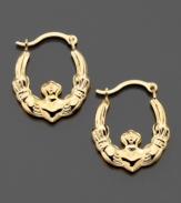 Friendship, love and loyalty. These claddagh hoop earrings are crafted in 14k gold. Approximate diameter: 1/4 inch.