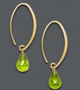 For a look that's divine. Luxurious hoops feature faceted peridot drops (6-3/4 ct. t.w.) suspended from a delicate 14k gold hoop setting. Approximate diameter: 1/3 inch.