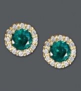 Put the green in your glamour. Effy Collection's dazzling button stud earrings feature round-cut emeralds (3/4 ct. t.w.) surrounded by halos of round-cut diamonds (1/8 ct. t.w.). Crafted in a 14k gold post setting. Approximate diameter: 1/4 inch.