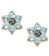 Spring forward. Victoria Townsend's sweet flower studs feature round-cut blue topaz (1-1/3 ct. t.w.) set in 18k gold over sterling silver. Approximate diameter: 3/8 inch.