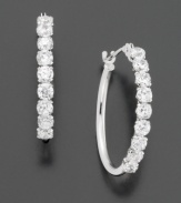 Round-cut cubic zirconia are set in 14k white gold. Earrings measure 3/4 inches.