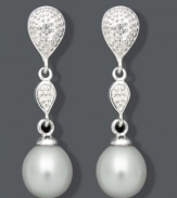 The perfect pair for the sophisticated woman. These elegant drops highlight cultured freshwater pearls (7-8 mm) and a double teardrop design accented by sparkling diamonds. Crafted in sterling silver. Approximate drop: 1 inch.