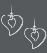 Dress yourself up in love. Touch of Silver's adorable double heart drop earrings feature a unique, asymmetrical design crafted in silver-plated brass. Ear wire crafted in sterling silver for sensitive ears. Approximate drop length: 1 inch. Approximate drop width: 1 inch.