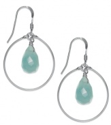 Crisp blue hues. These polished sterling silver hoops pop with the addition of blue jade drops (2-3/4 ct. t.w.). Earrings feature a fishhook backing. Approximate drop: 1 inch.