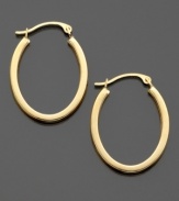 Get a classic look with a stylish edge with these unique flattened oval hoops crafted in 14k gold. Approximate diameter: 1/2 inch. Approximate drop: 1 inch.