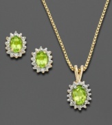 This set, consisting of earrings and a matching pendant, will lend chic sophistication to your everyday style. Victoria Townsend's design is inspired by royalty with exquisite oval-shaped peridots (1-3/4 ct. t.w.) flanked by sparkling diamond accents. Set in 18k gold over sterling silver. Approximate length: 18 inches. Approximate pendant drop: 5/8 inch. Approximate earring diameter: 3/8 inch.