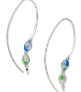 A sweep of color and a bit of polish. Jody Coyote's pretty loop earrings are crafted in sterling silver with silver and Czech glass accent beads in blue and green. Approximate drop: 1-1/2 inches.