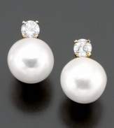 Classically beautiful jewelry with lasting style. These earrings feature cultured freshwater pearl (7-8 mm) and round-cut diamond (1/4 ct. t.w.) set in 14k gold.