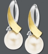 Sophistication at its finest. These pretty looped drop earrings combine a 14k gold and sterling silver setting with a cultured freshwater pearl (8 mm) and diamond accent. Approximate drop: 3/4 inch.