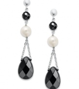 Ebony and ivory. Cultured freshwater pearls (6-1/2-7 mm) and faceted onyx (9 mm x 13 mm and 5 mm) create an elegant look on these dangling sterling silver earrings. Approximate drop: 1-3/4 inches.