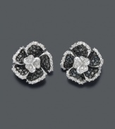 Stunning in stark contrast, these flower studs glimmer with black diamonds (1/3 ct. t.w.) and white round-cut diamonds (1/8 ct. t.w.). Earrings crafted in sterling silver. Approximate diameter: 1/4 inch.