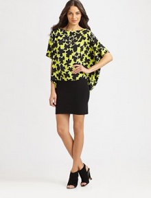 EXCLUSIVELY AT SAKS. A playful way to achieve that relaxed, contemporary aesthetic, this floral-print silk top has dropped shoulders and an asymmetrical hem. BoatneckDropped shouldersShort dolman sleevesAsymmetrical cropped front hemSilkDry cleanImportedModel shown is 5'9 (176cm) wearing US size X-Small/Small.