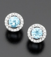 Elevate your style with twinkling round-cut aquamarine (3/8 ct. t.w.) stud earrings surrounded by round-cut diamonds (1/10 ct. t.w.). Set in 14k white gold.