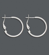 Spice up every ensemble with a simple pair of hoops. A stylish must-have for your accessory collection, these smooth sterling silver hoops feature a lever backing. Approximate diameter: 1 inch.