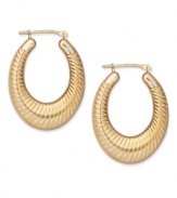 True craftsmanship. Scalloped edges and a chic oval shape add just the right detail to this stunning pair of hoop earrings by Signature Gold™. Crafted in 14k gold. Approximate drop length: 1-1/8 inches. Approximate drop width: 3/4 inch.