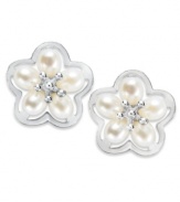 Sophistication meets spring. These petite flower stud earrings are decorated with cultured freshwater pearls (4-4-1/2 mm) at the petals and a gleaming sterling silver setting. Approximate diameter: 1/2 inch.