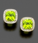 The fun and fresh color of cushion-cut peridot (2-5/8 ct. t.w.) shines brightly within a border of sparkling round-cut diamonds (1/4 ct. t.w.). Set in 14k gold.