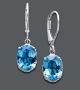 Add instant elegance to your look with perfect pools of color. Earrings feature oval-cut blue topaz (4-1/3 ct. t.w.) set in 14k white gold. Approximate drop: 1 inch.