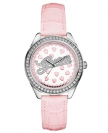 A playful timepiece from GUESS with feminine crystal accents and pink hearts.