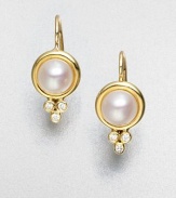 Luminous elegance in this diamond accented cultured pearl design in radiant 18k gold. Cultured pearls18k goldDiamonds, .09 tcwLength, about .8Hook backMade in Italy