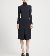 This chic, artfully tailored one-piece features a flattering culotte silhouette.TurtleneckLong sleevesPanel constructionInverted front and back pleatsConcealed back zipSilk liningAbout 44 from shoulder to hemWoolDry cleanMade in USA of Italian fabricModel shown is 5'10 (177cm) wearing US size 4. 