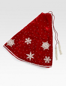 EXCLUSIVELY AT SAKS. Shimmering hand-embroidered snowflakes float across this lush velvet tree skirt, from renowned designer Sudha Pennathur. HandcraftedVelvet with bead embroidery50 diam.Dry cleanImported