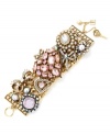 Very Victorian. Betsey Johnson's heart-themed wide toggle bracelet clearly conveys vintage inspiration. Elaborately embellished with chains, bows, crystals and glass pearls, it's crafted in antique gold tone mixed metal. Approximate length: 8 inches.