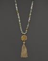 A carved pendant finished with bold tassel lends exotic flair to this beaded aquamarine necklace from Lara Gold for LTC.