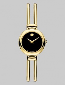 Timepiece and jewelry in one, a double bangle bracelet of goldplated stainless steel has a black Museum dial. Quartz movement Water-resistant to three ATM Round case, 18mm Adjustable bracelet, 10mm Made in Switzerland