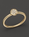 Diamonds glitter in a 14K. yellow gold setting.