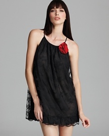 Layered lace lends dreamy style to this rosette-accented babydoll from Flora Nikrooz.